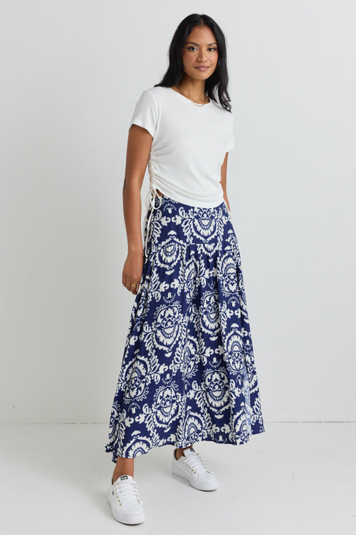 model wears a blue print maxi skirt