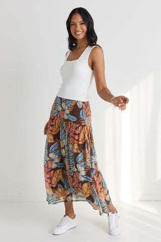 model wears a brown floral maxi skirt