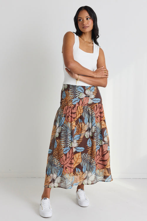 model wears a brown floral maxi skirt