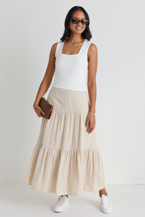 model wears a beige linen skirt