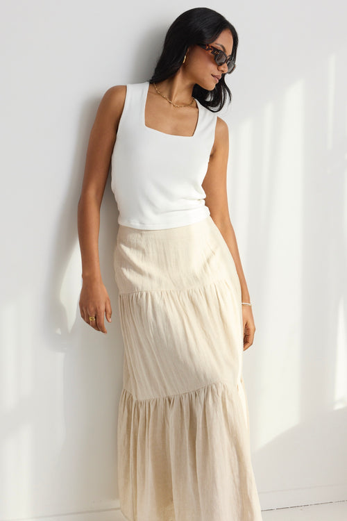 model wears a beige linen skirt