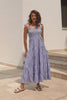 Woman wears a blue white stripe dress