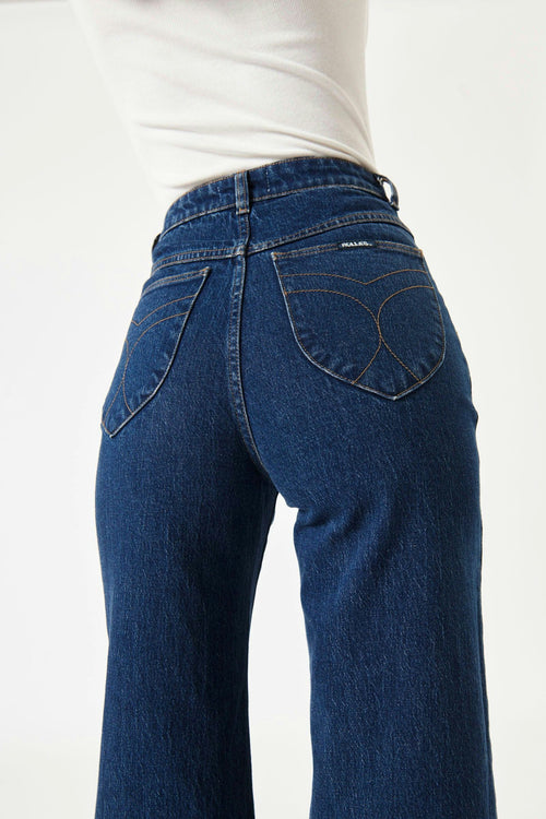 model wears blue wide leg jeans