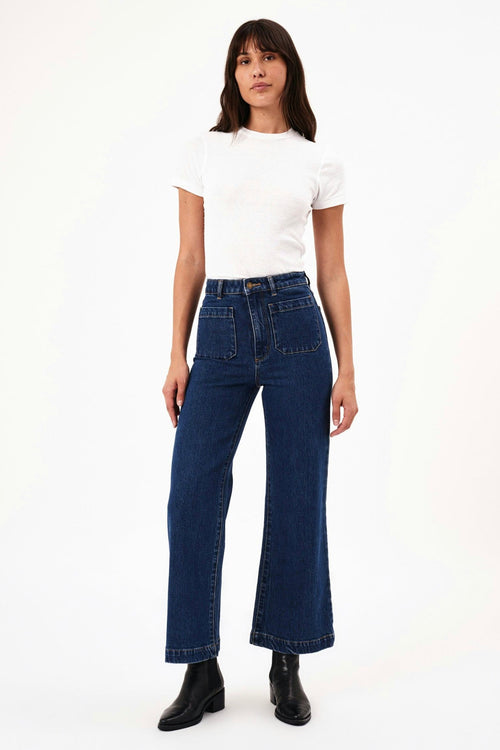 model wears blue wide leg jeans