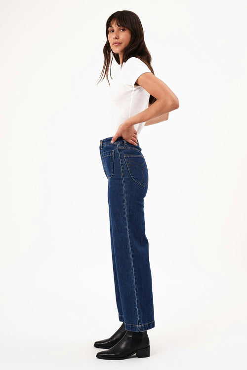 model wears blue wide leg jeans