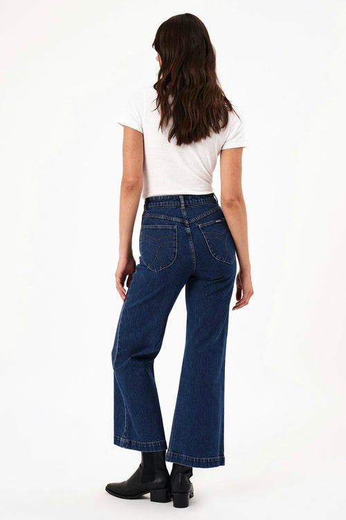 model wears blue wide leg jeans