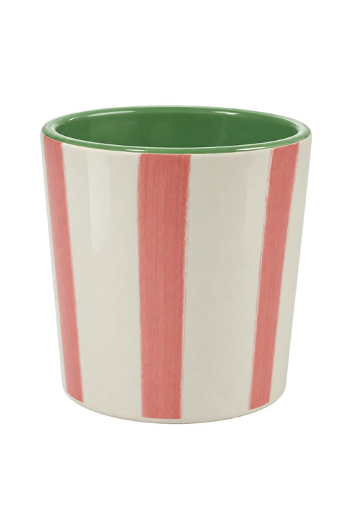 A ceramic cup with a white exterior featuring four vertical coral-pink stripes, and a glossy green interior, shown on a plain white background.
