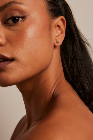 model wearing Bubble Heart Stud Rhodium Earrings