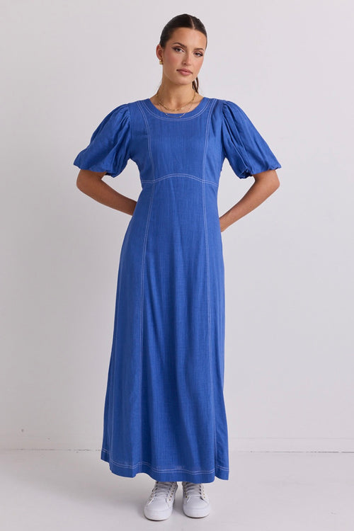 model wears a blue maxi dress