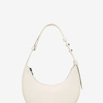 White handbag on a light beige background