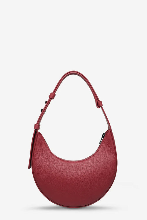 Red handbag on a light gray background