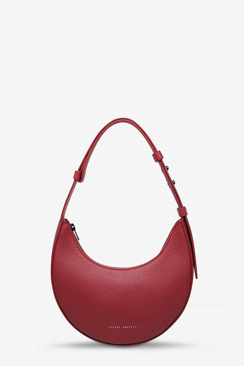 Red handbag on a light gray background
