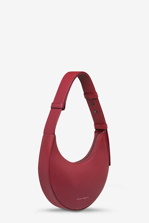 Red handbag on a light gray background