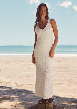 model in long white knit dress