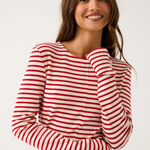 Woman wearing a red and white striped shirt against a white background
