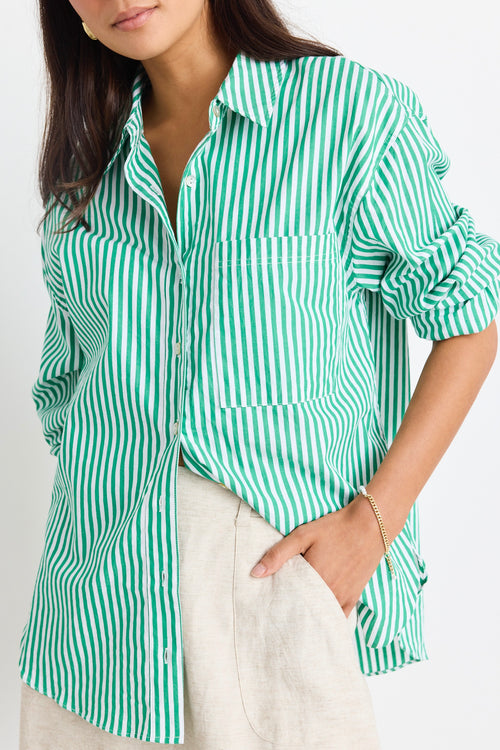 model wears a green stripe shirt