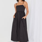 model wears black cotton maxi dress